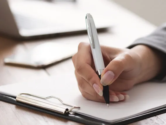 A faculty is marking down the items that have been reviewed in her Course Readiness Checklist.