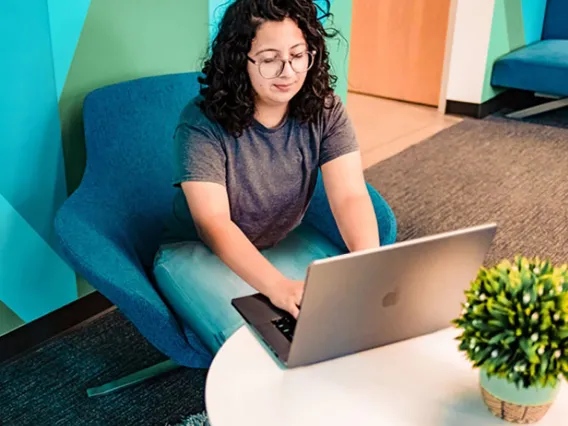 A faculty member is reviewing the design resources for online courses in her laptop computer in order to start creating her course.