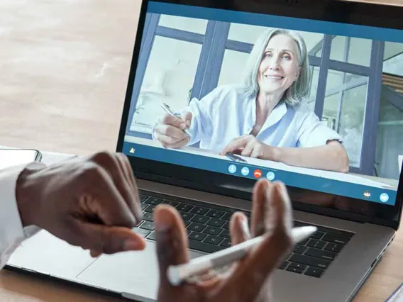 Two people having a virtual meeting.