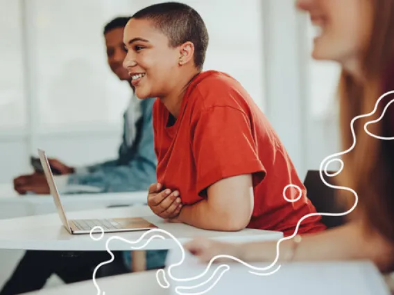 Smiling girl in University classroom. Abstract graphic white lines in the bottom right corner.