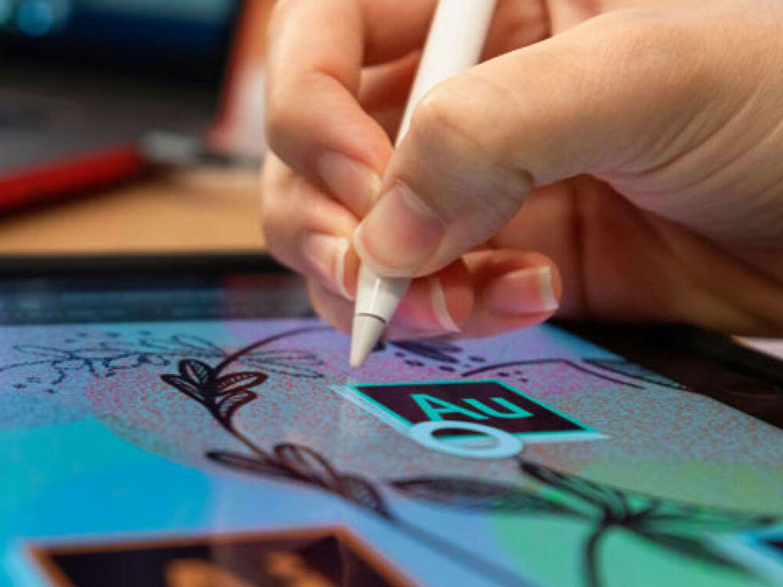 A student using Adobe mobile apps on her iPad with her Apple pencil.