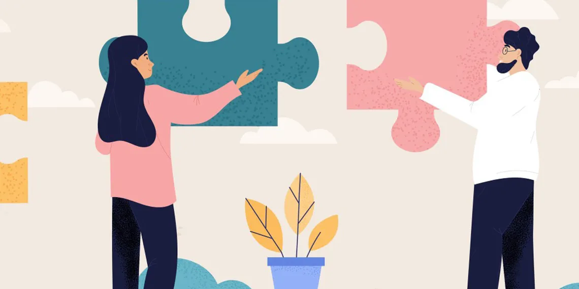 Vector illustration of female and a male holding colorful puzzle pieces.
