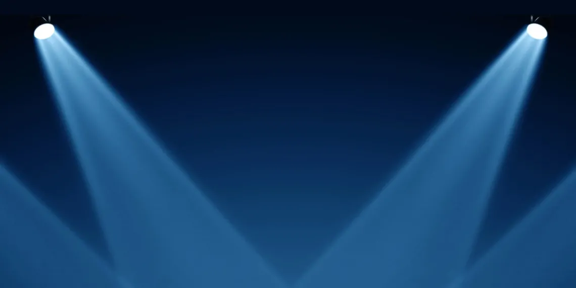 Vector illustration of spotlights shining down on a stage.