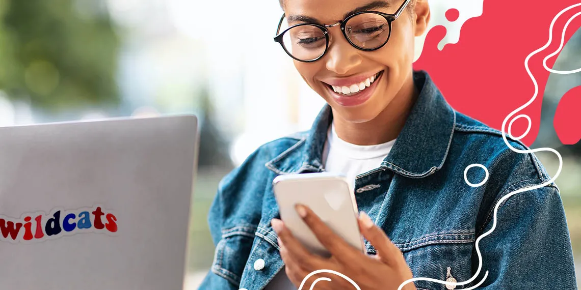 An African American female student wearing glasses holds a laptop and looks down at a phone. Illustrated abstract red and white lines in the background.
