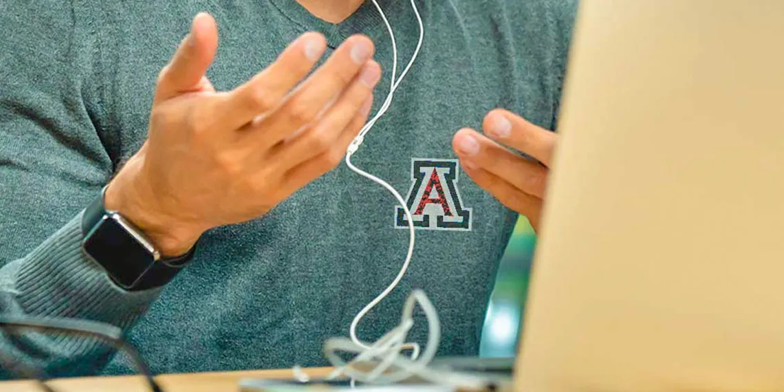 A student using hand gestures while speaking at a virtual conference call.