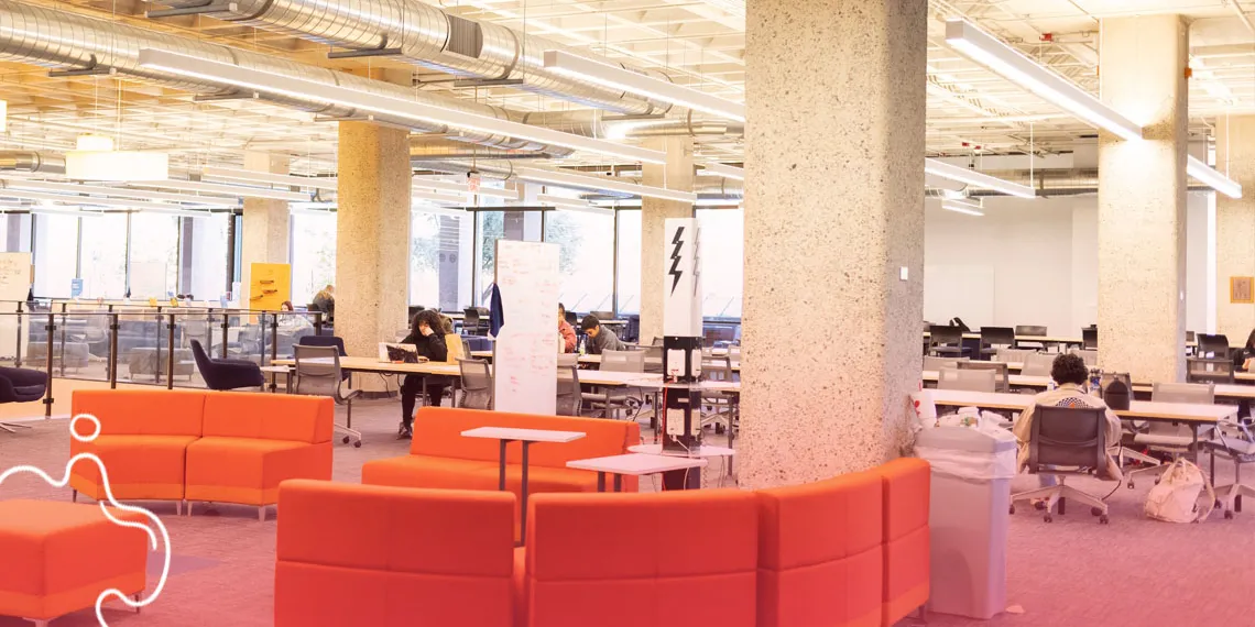 Oranges couches in a study-working area at the UArizona library.